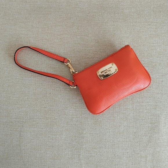 Michael Kors Handbags - Michael Kors Fuchsia Colored Wristlet